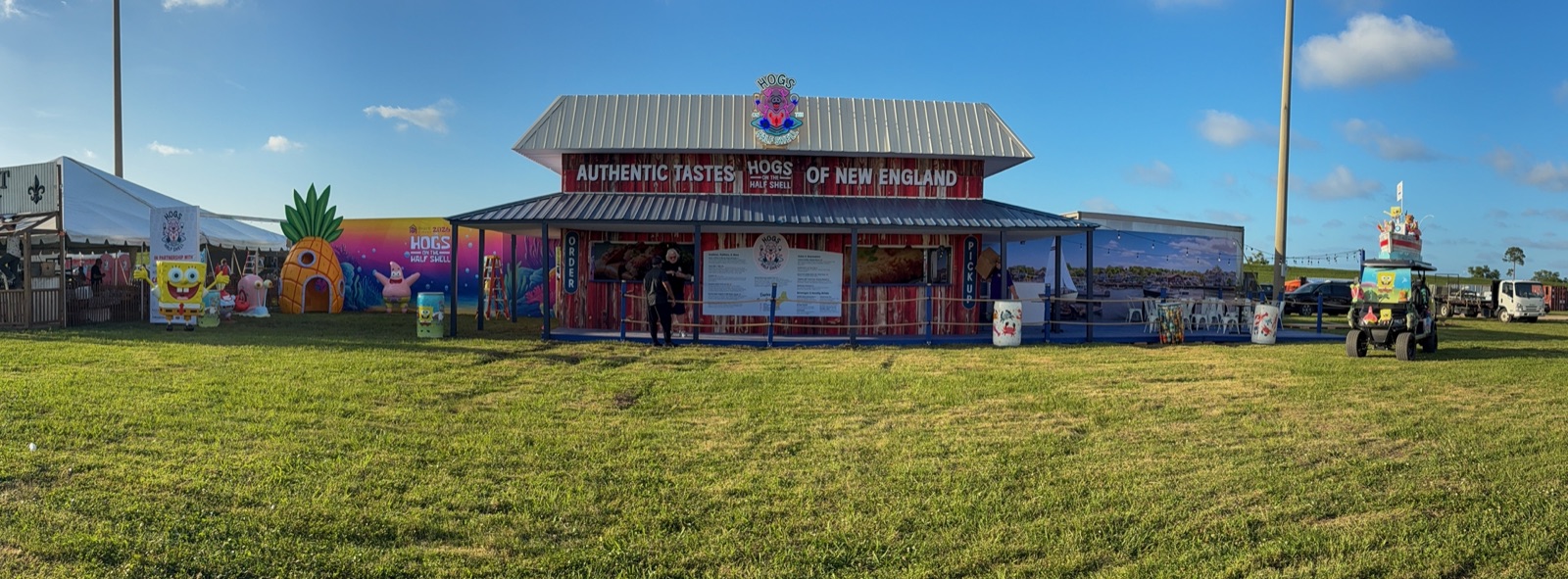 The full Hogs on the Half Shell booth in daylight