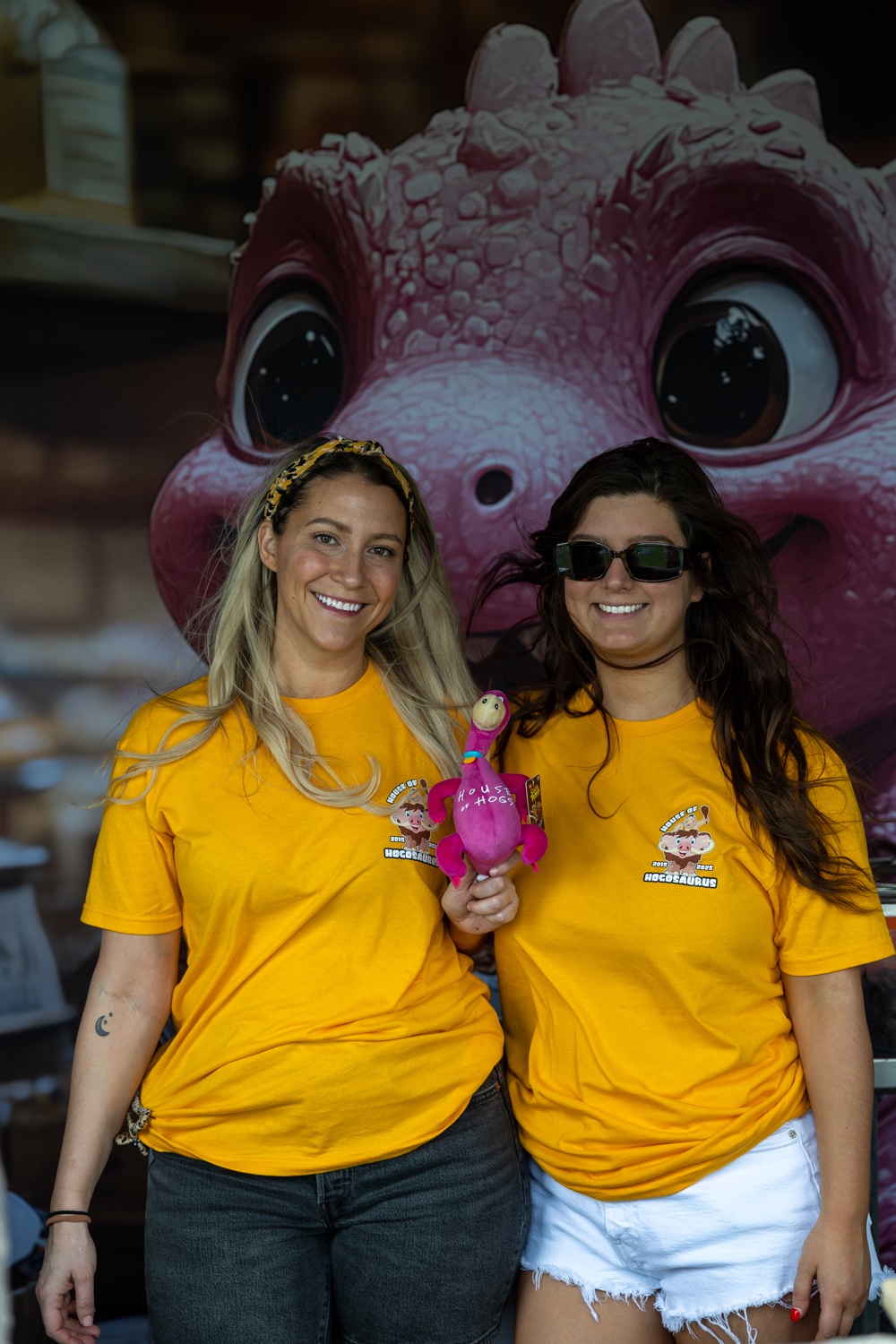 Volunteers with the Patrick piggybank at the booth