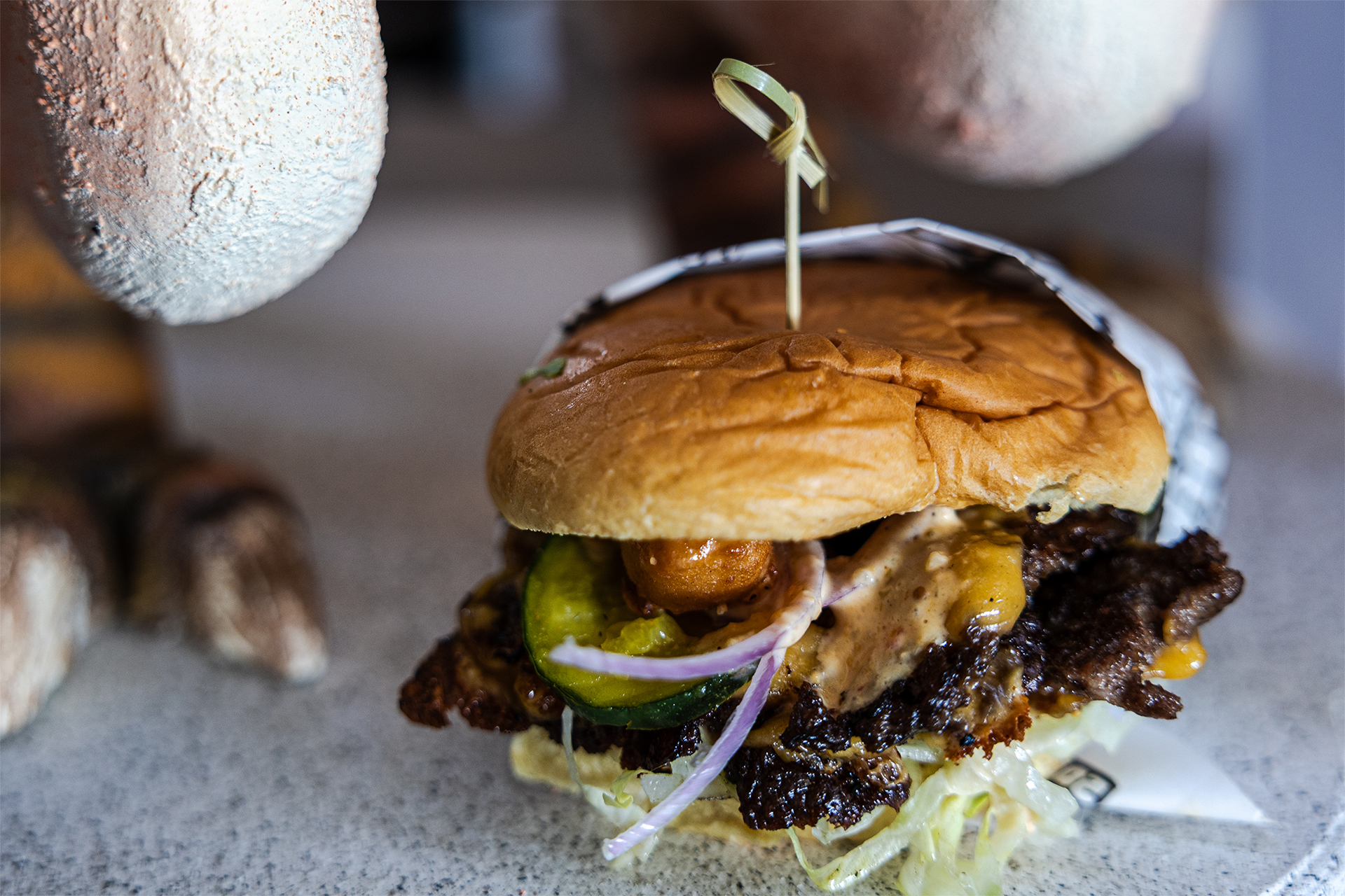 A House of Hogs smashburger — what you'll find at our food booth