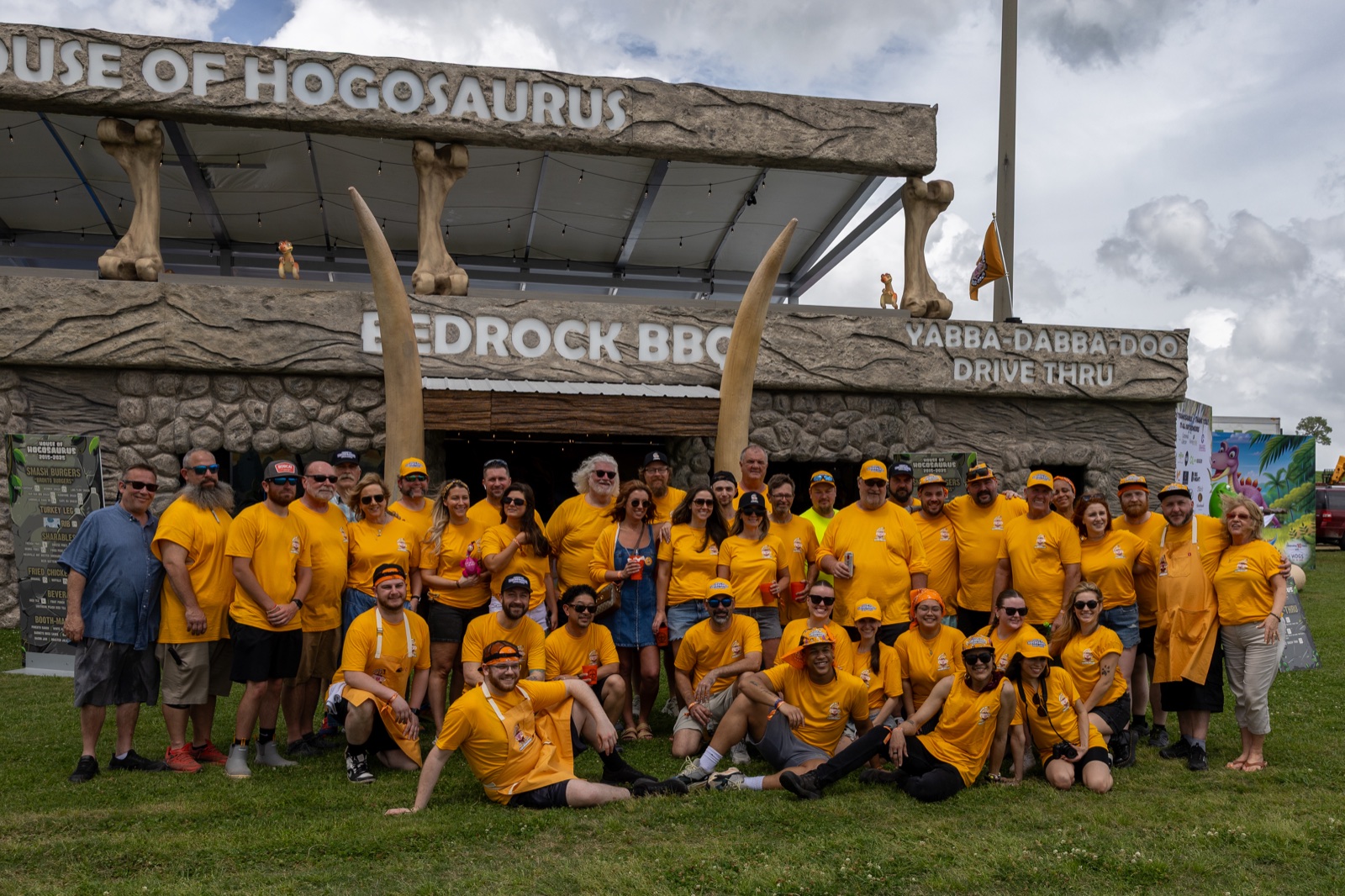 The entire House of Hogs crew in front of the House of Hogosaurus booth